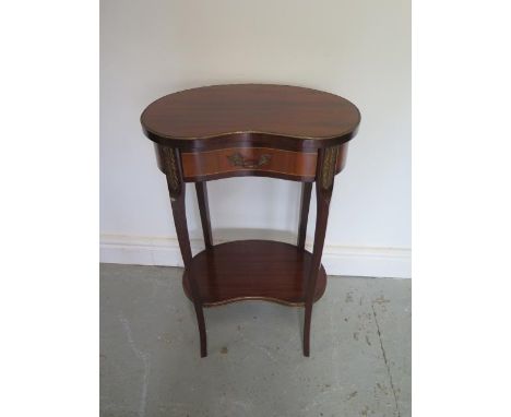 A French mahogany and oak inlaid kidney shaped 2 tier lamp table with frieze drawer with brass and ormulu mounts, 68cm tall x