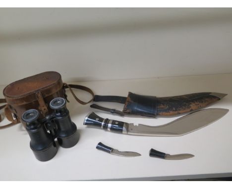 A Kukri with scabbard and small knives, blade length 31cm, some pitting to blades and wear to scabbard otherwise reasonably g