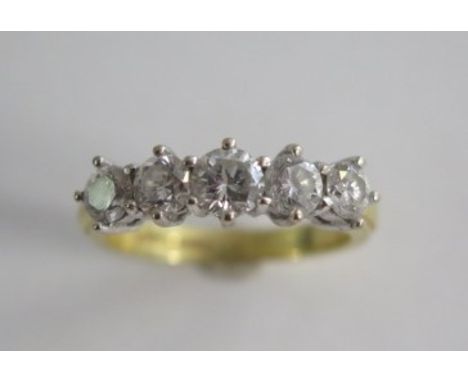 An 18ct yellow gold hallmarked 5 stone diamond ring, centre stone approx 0.30ct, size Q/R, diamonds bright generally good, ap