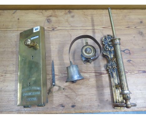 An ornate Victorian door pull with bell and a Lockerbie and Wilkinson Ltd locwil patent Vacant - Engaged brass lock 