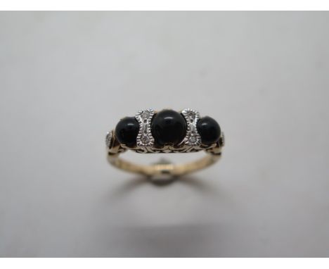 A 9ct yellow gold onyx and diamond ring, size M, hallmarked, in good condition, approx 3 grams 