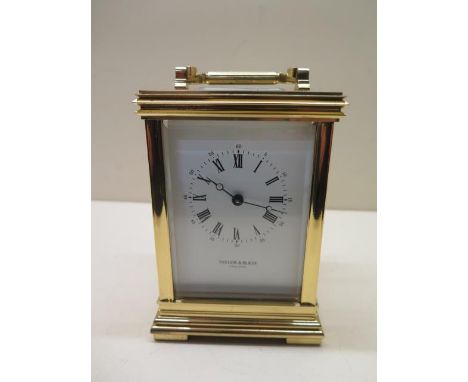 A Taylor and Bligh brass 8 day carriage clock striking on a bell, 15cm tall, brought in 1985 for £380, in good condition, run
