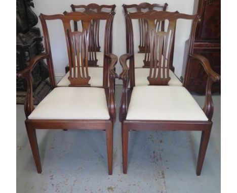 A circa 1900's mahogany set of 6 (4 + 2 carver) chairs in the Chippendale style with pierced splats drop in seats and taperin