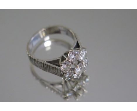 A good 18ct white gold diamond cluster ring, size L, approx 1.85ct total , 1 x round brilliant cut stone, colour J/K, clarity