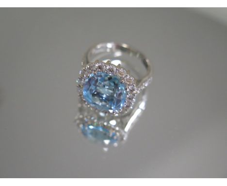 A hallmarked 18ct white gold blue topaz and diamond ring, approx 1.5ct of diamonds, size M, head approx 17mm x 15mm, in good 