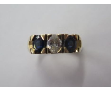 A 14ct yellow gold three stone diamond and sapphire ring, the centre diamond approx 2.5ct, size L, approx 6.2 grams, in good 