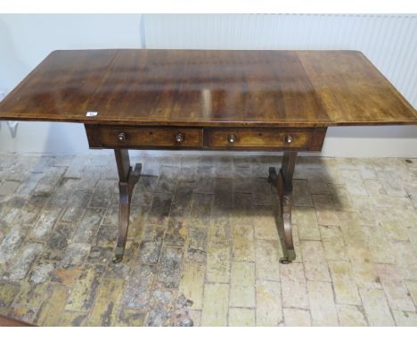 A 19th century rosewood dropleaf sofa table with 2 active and 2 dummy drawers, 75cm tall x 139cm x 61cm extended, in need of 