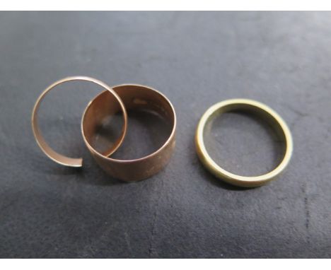 An 18ct yellow gold band ring, size P, approx 4 grams, and 2 x 9ct band rings, one cut, approx 4.6 grams 