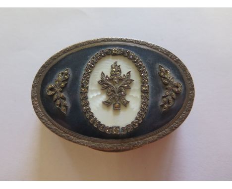 A Continental silver and enamel oval box with a hinged lid, 7cm x 5cm x 1.7cm approx 3 troy oz, enamel chipped to one panel, 