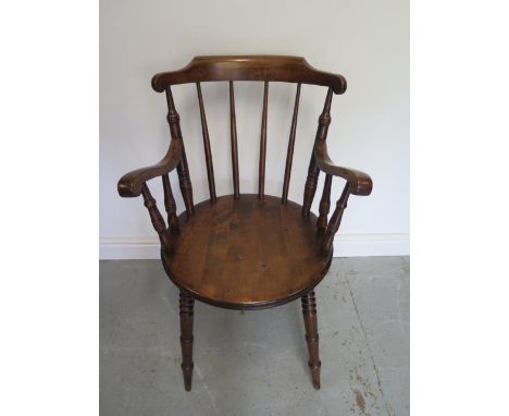 A circa 1900's Penny seat stick back armchair on turned tapering legs in polished restored condition 