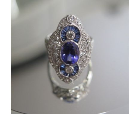 A good 750 white gold Art Deco style tanzanite, sapphire and diamond ring, tanzanite approx 1.9ct, sapphire approx 0.7ct, dia