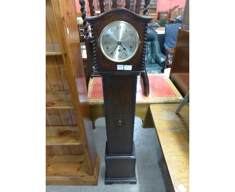 An oak dwarf longcase clock