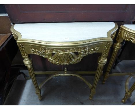 A reproduction French Louis XV style gilt console table