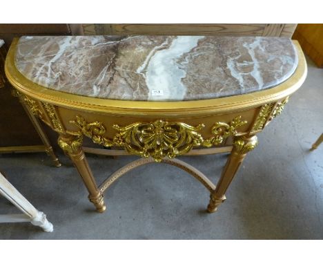 A reproduction French Louis XV style gilt console table