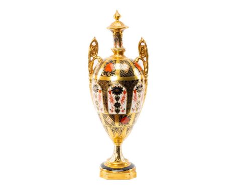 ROYAL CROWN DERBY '1128' PATTERN OVIFORM URN, with high scrolled twin foliate handles, on socle base, 30cms (h)Provenance: co