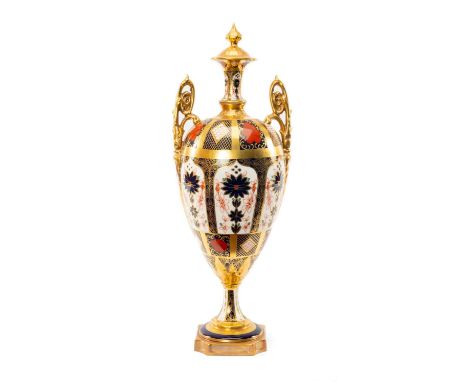 ROYAL CROWN DERBY '1128' PATTERN OVIFORM URN, with high scrolled twin foliate handles, on socle base, 41cms (h)Provenance: co