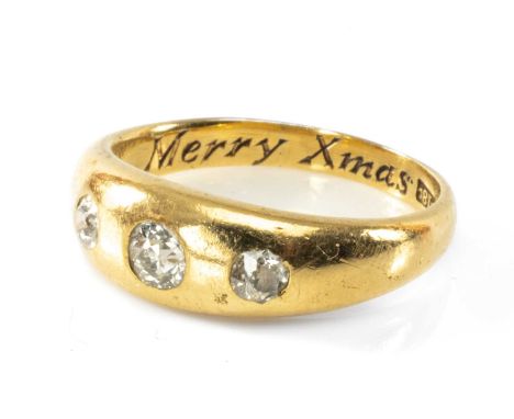 18CT GOLD THREE STONE DIAMOND RING, 0.4ct overall approx., engraved 'Merry Xmas '91', ring size Q, 6.7gmsProvenance: private 