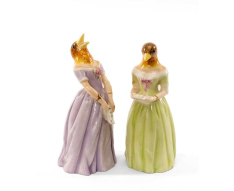 TWO ROYAL WORCESTER 'JENNY LIND' CANDLE SNUFFERS, Confidence and Diffidence, holding song sheets in lilac and green dresses r