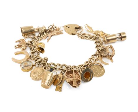 9CT GOLD CHARM BRACELET, heart shaped padlock, with fourteen 9ct gold charms including coracle, Welsh hat, animals etc, and a