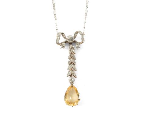 ANTIQUE WHITE & YELLOW METAL DIAMOND & CITRINE DROP PENDANT of petal and bow drop design terminating with pear shaped citrine