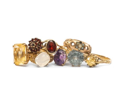 EIGHT 9CT GOLD RINGS set with citrine, amethyst, garnets, moonstone, seed pearls etc, 21.6gms gross (8)Provenance: private co