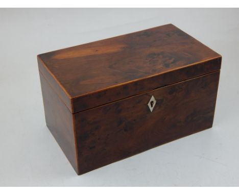 An early 20th century yew tea caddy with bone escutcheon and twin interior, W 22 cms