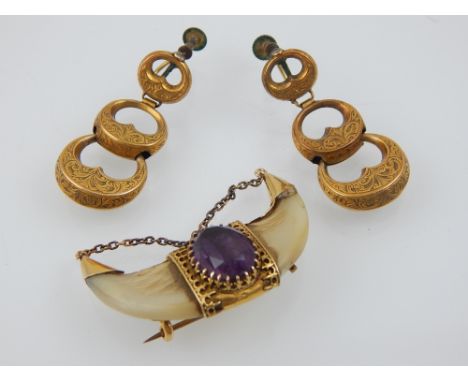 A Victorian yellow metal claw brooch, set central oval faceted amethyst, together with a pair of yellow metal triple drop ear