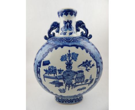 A Chinese Qing dynasty blue and white moon flask, decorated with vignettes of ornaments, amongst a geometric pattern, having 