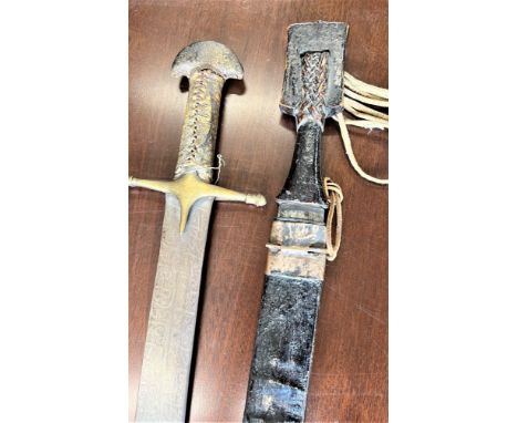 Two 19th century African Swords. On with scabbard. 