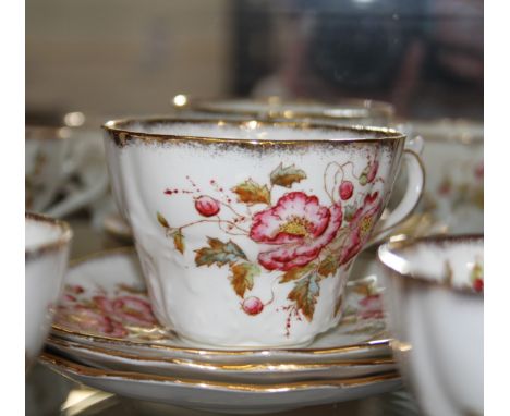 An Imperial China part tea-service comprising two cake plates, bowl, jug, tea cups, and twenty saucers. (34) 