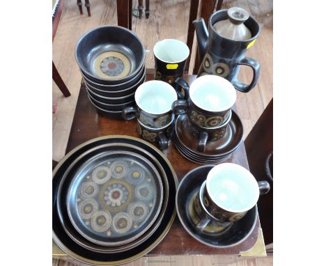 Denby Arabesque pattern table wares including coffee pot with lid, cups and saucers, different sizes of plates and seven bowl