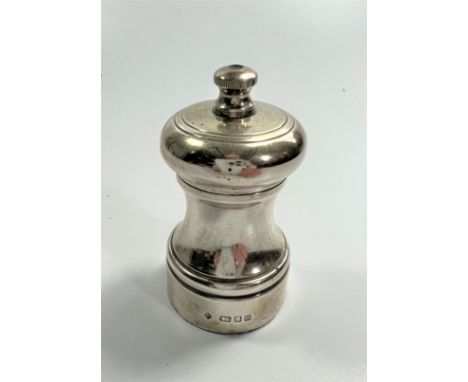 A Sterling Capstan Silver Pepper Grinder. London 1975.Quite plain.9cm high.