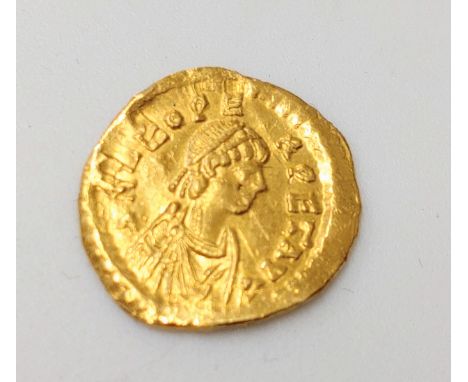 A Roman Gold Coin. A Gratian Gold Solidus.1.48 grams. 1.5cm diameter.