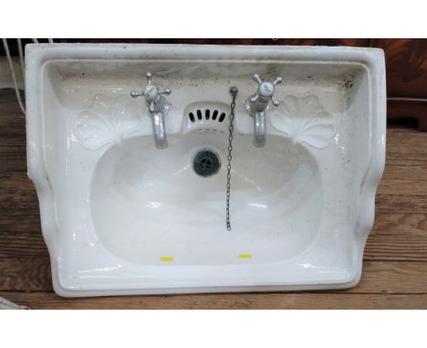 A Porcelain Sink and Support Bracket. Circa 1900. The Sink 57 x 44cm. 