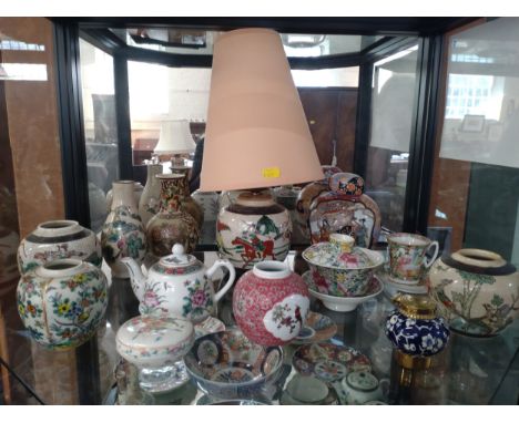 Two Chinese famille-verte ginger jars (one converted to a lamp), an antique inkwell, a Canton cup and saucer and other jars. 