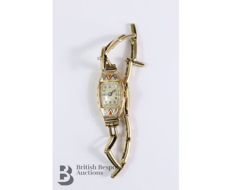 Lady's vintage 9ct gold and enamel wrist watch. The watch having a champagne face with numberic dial on a 9ct gold plated met