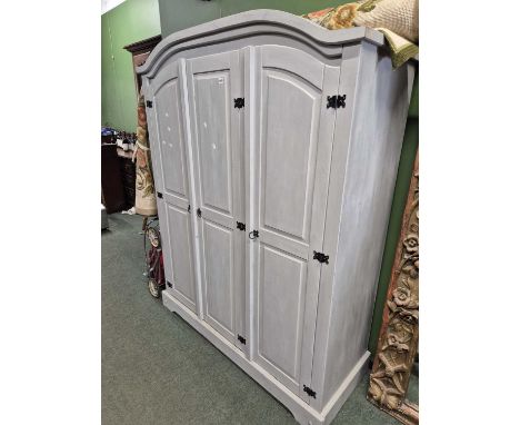 A modern painted pine wardrobe.