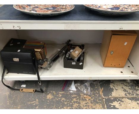 A cased Bolex cine camera, still cameras, a tripod and  a wooden cased microscope with an electronic light source