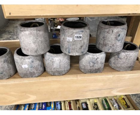 Eight cylindrical ceramic garden planters