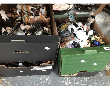 A large quantity of composition and ceramic dog and animal figurines