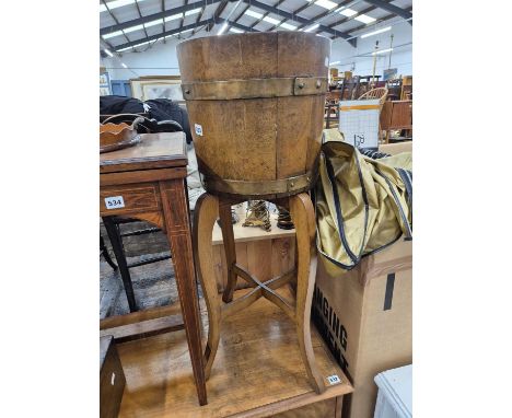 A Lister coopered oak planter on shaped stand.