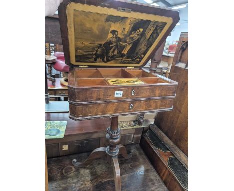A Regency mahogany work table on a tripod base.