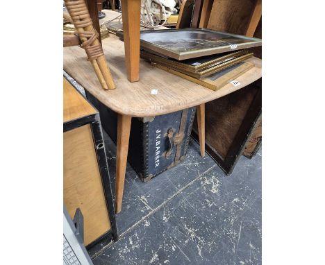 An Ercol pale elm dining table. H 72 L 154 W 77cms