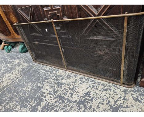 A brass rail top fireguard. H 56 W 132 D 49cms