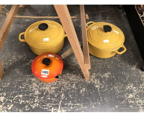Two Chasseur enamel cooking pots and covers and another by Le Creuset