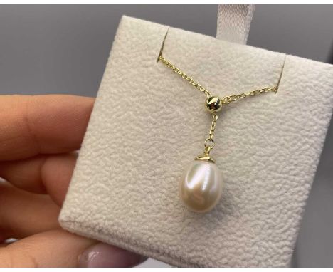 A silver and gold-plated adjustable slider necklace with a cultured pearl drop pendant. Longest length 47 cms. 