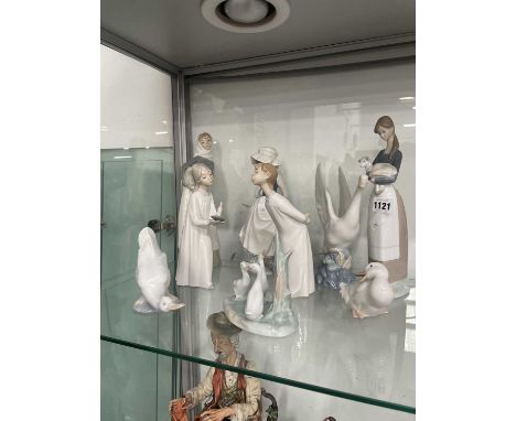 Nine Nao and Lladro figurines
