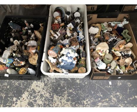 A collection of composition and ceramic animal and other figurines