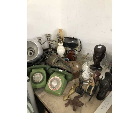 An African wooden mask, wooden figures, two avocado plastic telephone sets, table and ceiling lighting, glass bowls, etc.