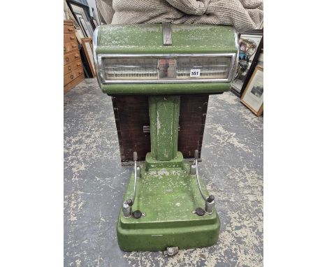 a set of large vintage shop weighing scales.